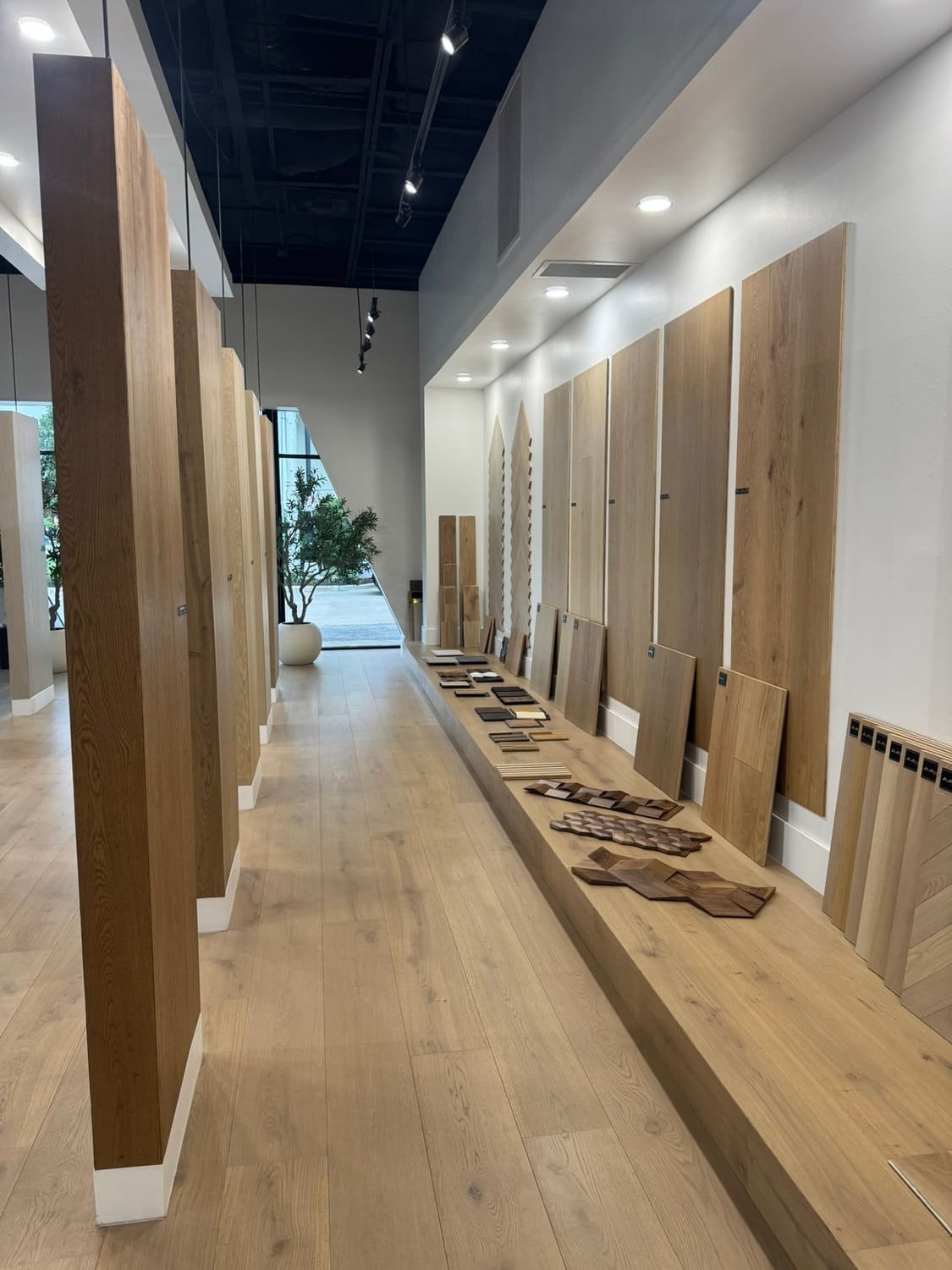 Jamail Hardwoods Houston showroom with premium wide-plank hardwood samples